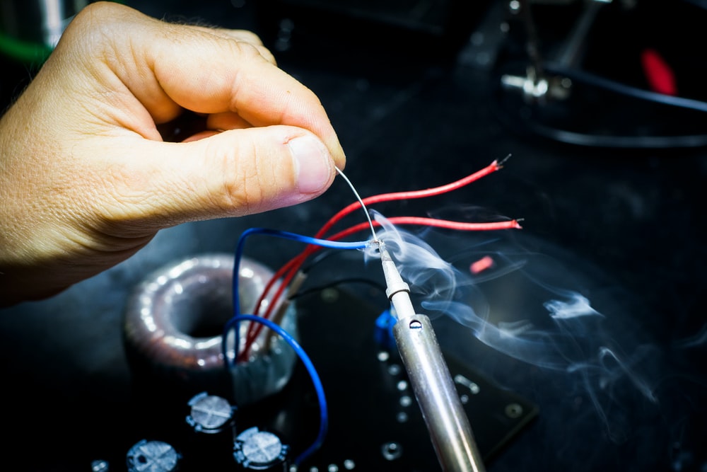 a person doing PCB assembly service.