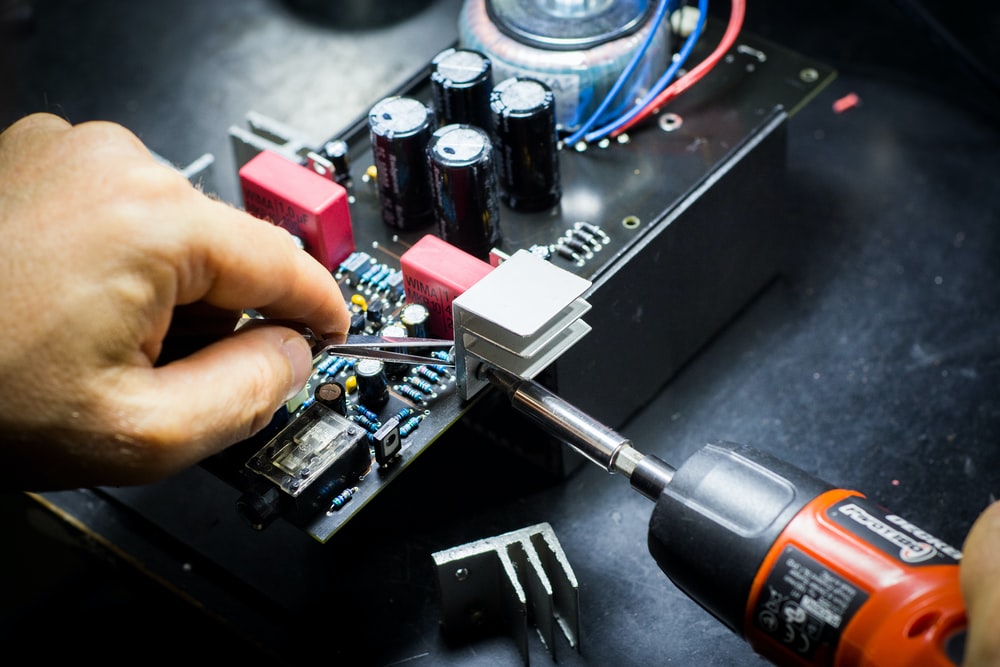a person doing PCB assembly service.